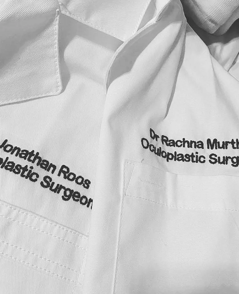 Dr Jonathan Roos and Dr Rachna Murthy in lab coats